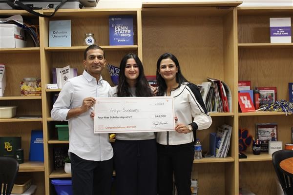  Student holding Scholarship Check