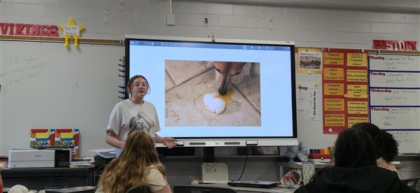 No omelet without broken eggs. Hands in the air Lucille explains the circumstances of her “Eggcellent” Photography Project. Students used eggs in various forms of photocomposition to practice capturing organic shapes and shadows, turning a kitchen staple into a work of art.